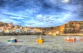 Staithes North Yorkshire England uk with boats in harbour in colourful hdr Royalty Free Stock Photo