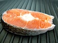 Stake of salmon on pan