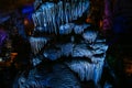 A stalactite and stalagmite cave in blue color