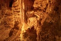 Stalagmite with color light in the cave