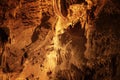Stalagmite with color light in the cave