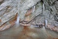 Stalagmites and stalactites inside the underground glacier in Scarisoara glacier cave. Royalty Free Stock Photo