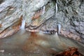 Stalagmites and stalactites inside the underground glacier in Scarisoara glacier cave. Royalty Free Stock Photo