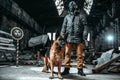 Stalker in gas mask and dog in radioactive zone Royalty Free Stock Photo