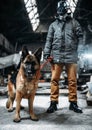 Stalker in gas mask and dog in radioactive zone Royalty Free Stock Photo