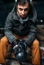 Stalker with gas mask, post apocalyptic lifestyle Royalty Free Stock Photo