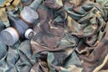 Stalker soldiers soviet gas mask lies on many green khaki camouflage jackets