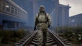 A stalker walks along railway tracks in a desolate, dreary post-apocalyptic world. A man surviving a nuclear apocalypse