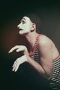 Stalking actor mime on a black background