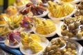 Stall with exotic fruits on the tropical street market. Chopped pineapples and other fruits. Royalty Free Stock Photo