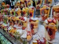 Stall with fruit salads in cups for sale in a market