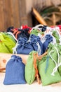 Stall herbalist collecting plants sachet natural jute bag blue green white lots background Royalty Free Stock Photo