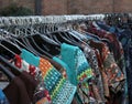 Stall with many vintage clothes hanging for sale