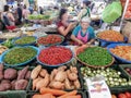 Large trays with fresh chilies on a busy Thai market
