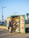 Stall with souvenirs. Stall book. An elderly man chooses a souvenir. Magnets for memory