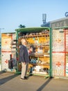 Stall with souvenirs. Stall book. An elderly man chooses a souvenir. Magnets for memory