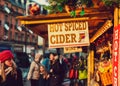 SHEFFIELD, UK - 8TH DECEMBER, 2018: Locals selling teasty hot spiced cider to tourists at Sheffields Christmas Markets