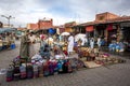Stalls selling various goods including hats and baskets in the Marrakesh medina in Morocco.