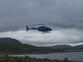 Staloluokta, Norrbotten, Sweden, Agust 11, 2021: Blue Fiskeflyg helicopter with tourist and supplies landing at sami