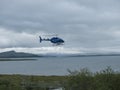 Staloluokta, Norrbotten, Sweden, Agust 11, 2021: Blue Fiskeflyg helicopter with tourist and supplies landing at sami