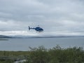 Staloluokta, Norrbotten, Sweden, Agust 11, 2021: Blue Fiskeflyg helicopter with tourist and supplies landing at sami