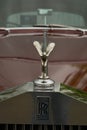 Stamford, United Kingdom. May 31, 2019 - Luxury vintage Rolls royce emblem, red car, outdoor