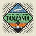 Stamp with airplane, compass, mountains and text Tanzania Royalty Free Stock Photo