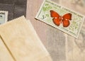 Stamp with butterfly among other stamps