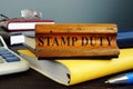 Stamp duty sign and office supply with business papers.