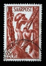 Stamp from Germany area Saar shows Building workers