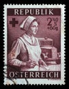 Stamp issued in the Austria shows Red Cross nurse and ambulance, Red Cross and Red Crescent series