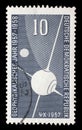 Stamp issued in Germany - Democratic Republic DDR shows Artificial satellite Sputnik I, part of the earth, moon Royalty Free Stock Photo