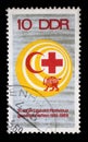 Stamp issued in Germany - Democratic Republic DDR shows Red Cross and Red Crescent, the 50th Anniversary of Red Cross