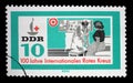 Stamp issued in Germany - Democratic Republic DDR shows Red Cross nurse, 100 years International Red Cross series Royalty Free Stock Photo