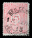 Stamp issued in Kingdom of Serbs, Croats and Slovenes shows numeric value Royalty Free Stock Photo