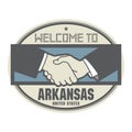 Business concept with handshake and the text Welcome to Arkansas