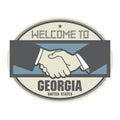 Business concept with handshake and the text Welcome to Georgia, United States