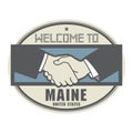 Business concept with handshake and the text Welcome to Maine, U