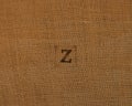 Stamp letters on linen fabric. Letter Z.