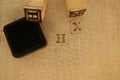 Stamp letters X and H on linen cloth