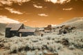 Stamp mill and homes on hillside in Bodie, California in infrared Royalty Free Stock Photo