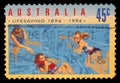 Stamp printed in Australia shows the People in Water, Centenary of Organized Life-saving in Australia