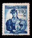 Stamp printed in Austria shows image woman in national Austrian costumes, Kitzbuhel