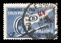 Stamp printed in Belgium shows Winged Wheel with blue surcharge