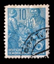 Stamp printed in GDR, shows Farmer, worker, intellectuals Royalty Free Stock Photo