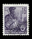 Stamp printed in GDR, shows a worker Royalty Free Stock Photo
