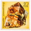 Stamp printed in German Democratic Republic East Germany shows semiprecious stone Zinwaldit, Minerals Zinnwaldite