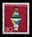 Stamp printed in Germany showing the graphic representation of lenses with refraction of light, 100 years of scientific microscope