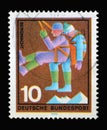 Stamp printed in Germany showing a rescuer with injuries: volunteer mountain rescue service