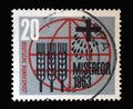 Stamp printed in Germany showing Stylized ears of corn, grains, cross